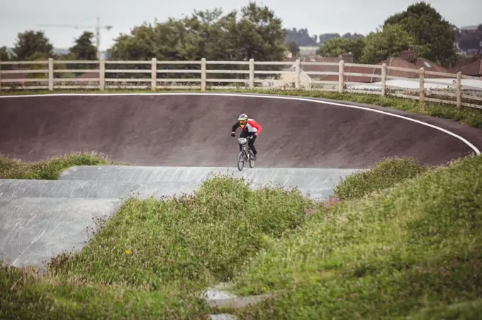 Cyclist riding BMX bike in skatepark