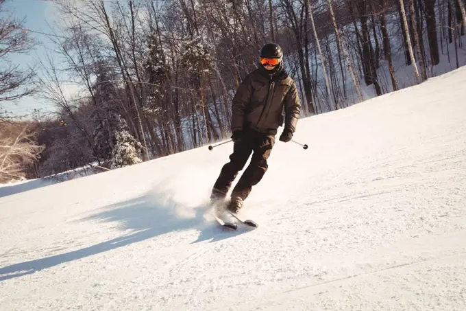 Skier skiing on the snowy mountain slope