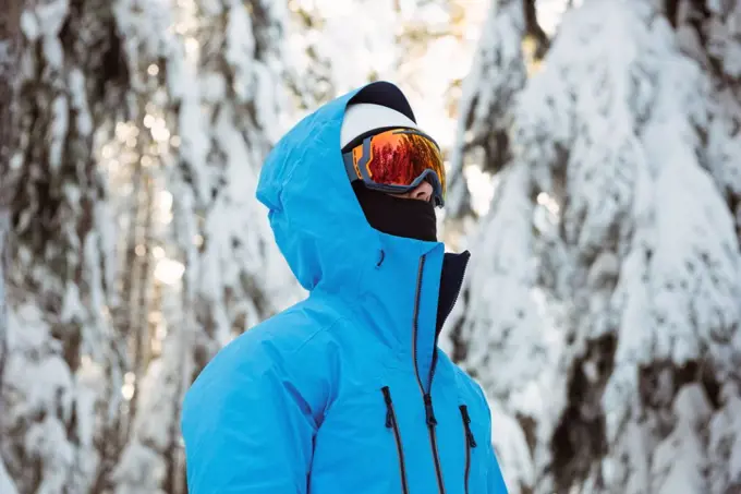 Skier looking at beautiful snow covered mountains