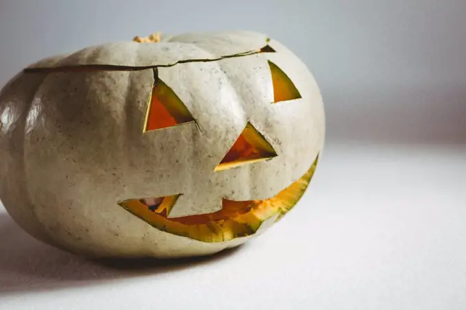 Close up of white jack o lantern on white background