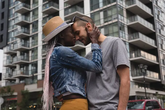 Happy couple embracing in the city