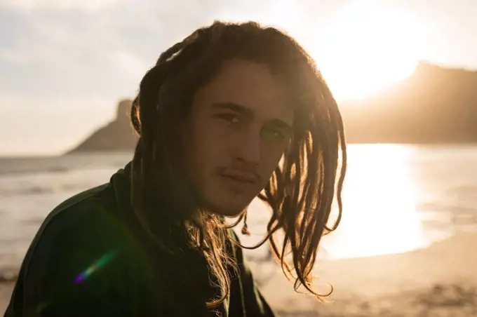 Portrait of man looking at camera on the beach