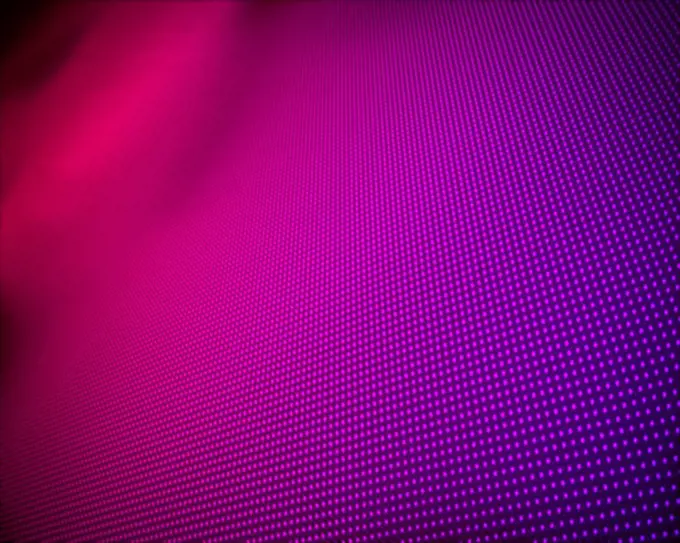 Background of multiple purple dots fading to magenta