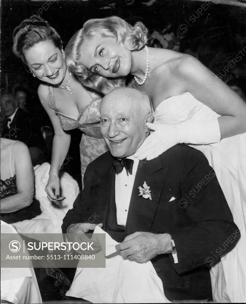 Dorothy Lamour and Lizabeth Scott join in congratulating Zukor at his 80th birthday party at the Waldorf-Astoria, New York, on March 4, 1953. March 20, 1953.