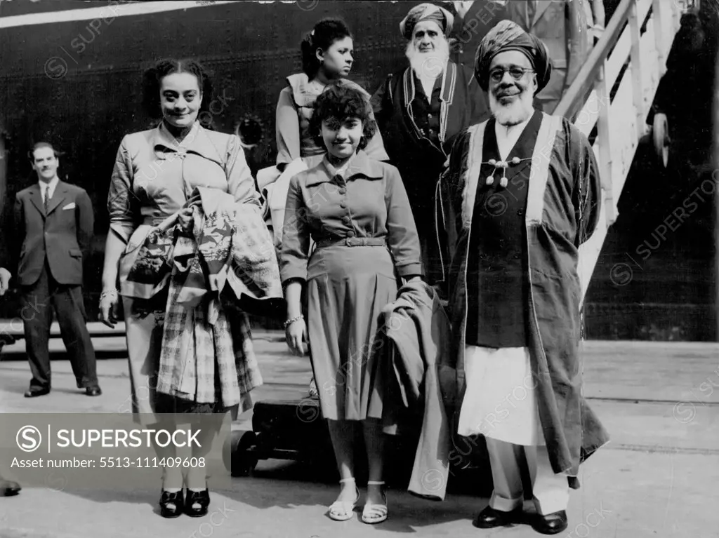 Here For The Coronation -- H.H. The Sultan of Zanzibar, Sir Seyyid Khalifa Bin Herub, with the Sultan and their daughter, Princess Amal, photographed when they arrived in the S.S. Kenya at Royal Albert docks this morning. May 23, 1953.