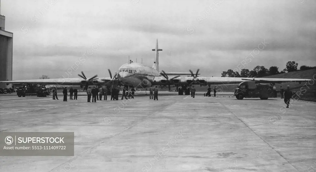 The Brabazon's 'Props' Turn -- The engines of the 'Brabazon' being 'tuned-up' outside its hangar at Filton, Bristol. Shortly after half-past seven this (Saturday) morning, the 'Brabazon', largest civil landplane in the world, was on its mile-and-a-half long runway at Filton, Bristol. ready to start taxi-in tests. It left its hangar yesterday for a final check-up, technicians using mobile scaffolding to inspect the wingh, rudder and the eight 2,500 h.p. engines. After its tests today the 130-ton