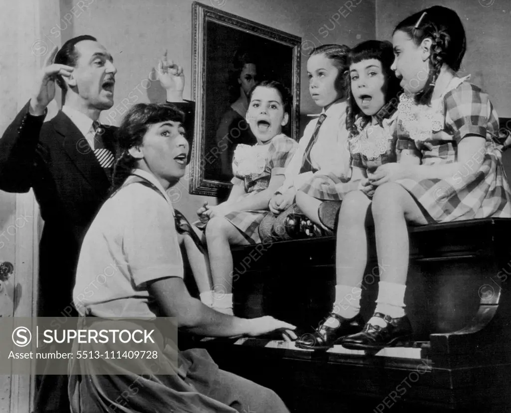 Piano Four-Tissimo - The Zarief quadruplets hold down the piano in their Brooklyn home today as they celebrate their sixth birthday with a musicale in which their concertmaster father, Harry Zarief, leads while their mother thumps the keys. The quads are (left to right): Isadora, Bennett, Elaine and Ellen. The father is also assistant conductor of a radio symphony orchestra. March 29, 1950. (Photo by AP Wirephoto).