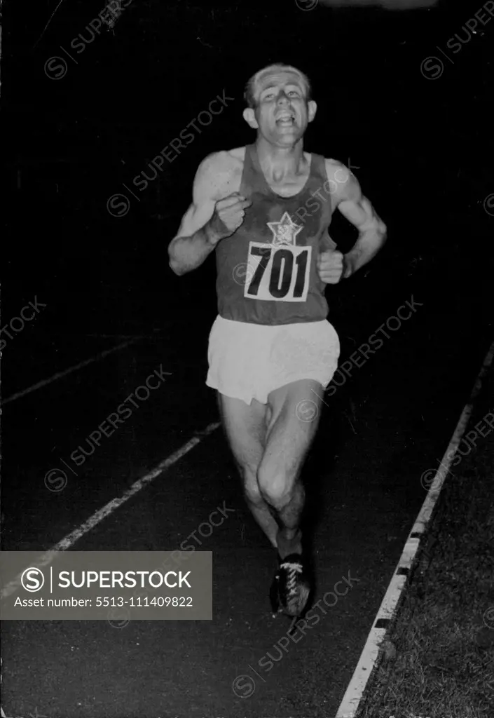 Picture of Emil Zatopek winning the 10, 000 meters at the European Games in 1954. Zatopek Leads The Way -- Zatopek burning up the track during the 10,000 metres last night... Emil Zatopek, the famous 'Bounding' Czech, won the 10,000 metres at Berne yesterday during the first day of the European Games. Kovacs of Hungary was second, with Frank Sando, of great Britain, third..... August 26, 1954. (Photo by Paul Popper Ltd.).