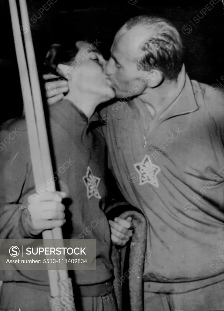 Double Triumph For Mr. And Mrs. Zatopek -- Emil Zatopek (right), the great Czech distance runner, kisses his wife, Dana after she had won the Women's javelin event with a throw of 52.91 metres and he had won the 10,000 metres championships in the European Games today August 25. This was a repeat performance of their double success in the Helsinki Olympics when on one afternoon the Czech Colonel Took the 5,000 metres and his wife won the Javelin Title. September 3, 1954. (Photo by Associated Pres