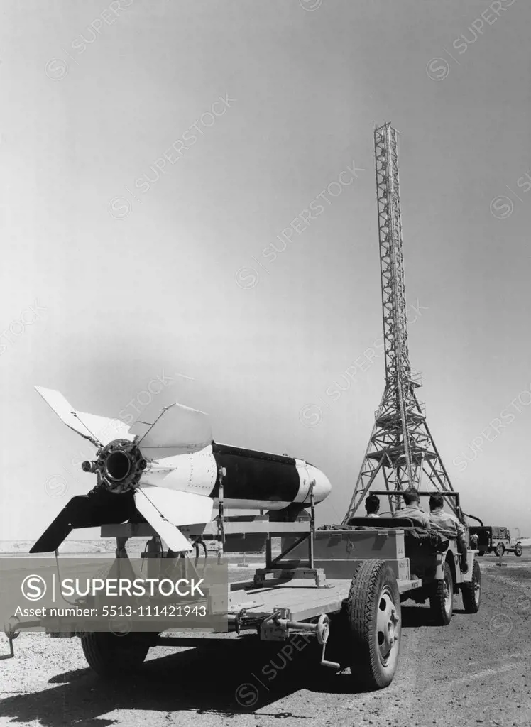 NATIV, a North American Aviation guided missile, nears a tall launching tower where it will be test fired. NATIVS, traveling at supersonic speeds, have reached trajectory altitude of 10 miles during recent tests. April 6, 1949. (Photo by North American Aviation, Inc.)