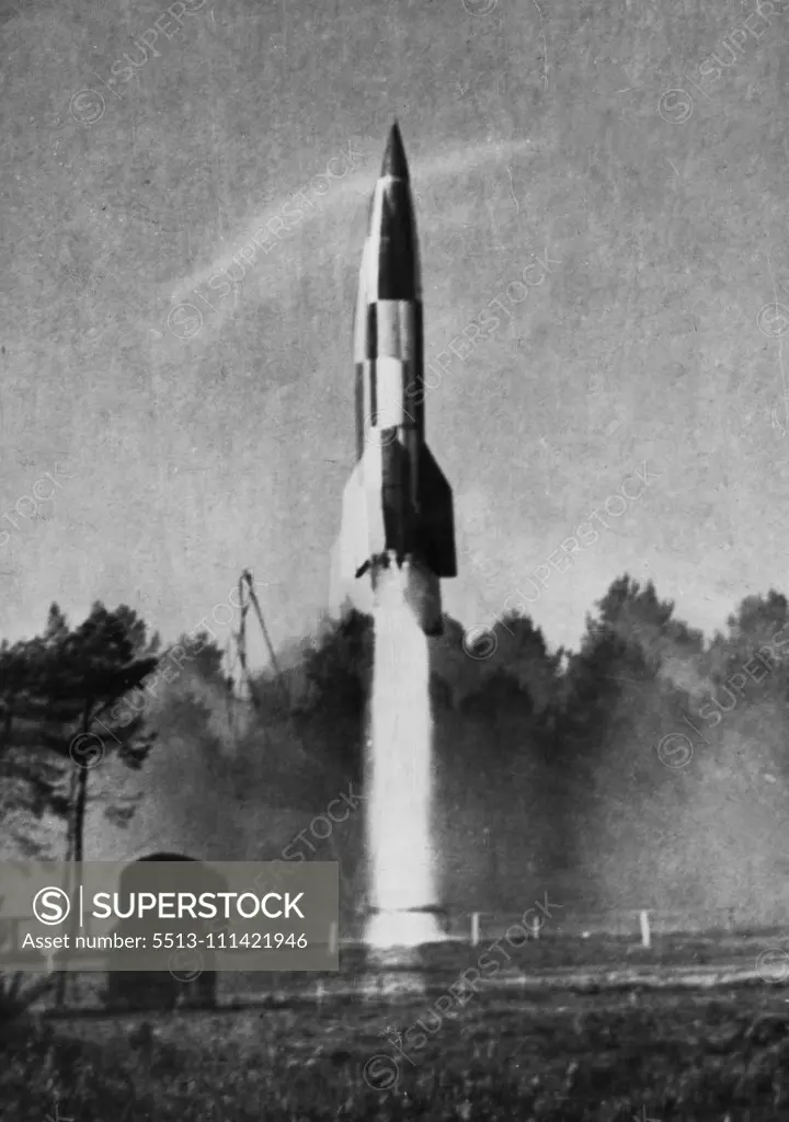 V.2 Equipment -- A view of rocket at the commencement of flight. At Cuxhaven B.A.O.R. Scientific experts are experimenting with the V. 2 rockets. The picture show stages in the preparation and firing of a rocket. October 5, 1947. (Photo by British Official Photograph).