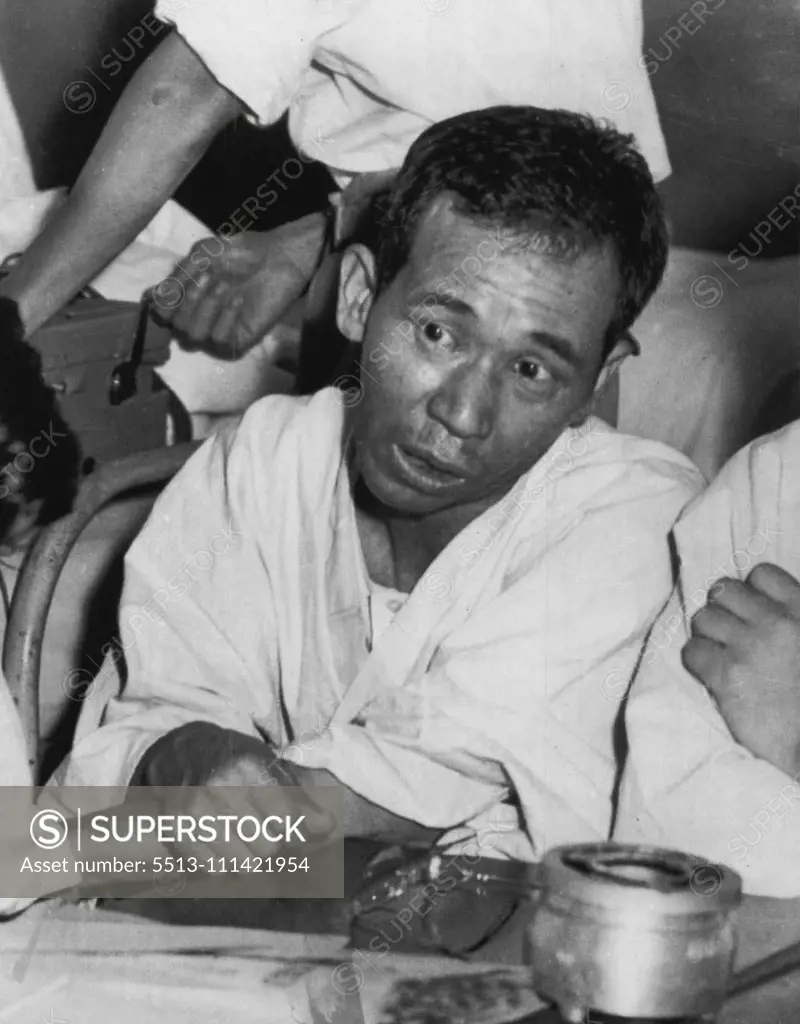 Japanese H-bomb Victim -- Aikichi Kuboyama, 39, who was aboard the Japanese fishing vessel "Lucky Dragon" when it was burned by ash from an American H-Bomb blast, talks with newsmen during an interview where he and 21 other members of the crew are being treated, in Tokyo. This picture was taken recently, but he has since become worse and has been in a coma more than 30 hours. His condition is critical. September 1, 1954. (Photo by AP Wirephoto).