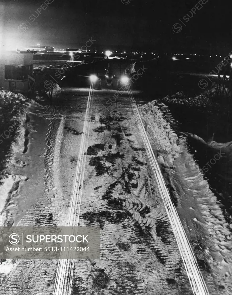 The Striking Power Of A U.S. Fighter -- Streams of tracer bullets pour from the wing-guns of a Curtiss Kittyhawk fighter plane in spectacular night demonstration of the craft's striking power. The demonstration was at one of Curtiss-Wright's plants in New York State, on the eastern U.S. seaboard. August 6, 1942.