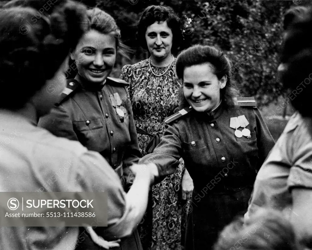 A.T.S. girls meeting Russian girl snipers. A.T.S. meet Russian girl snipers. An A.T.S. Garden Party was held in the British Delegation area of Potsdam. The party was attended by Junior Commander Mary Churchill, the Prime Minister's daughter. The A.T.S., girls met two Russian girl snipers who were at Stalingrad during the seige of that city, and are seen wearing the Stalingrad Medal. Their names are Nina Poplavski of Vitebsk and Maria Byskaravyn of Stalingrad. October 15, 1945. (Photo by British