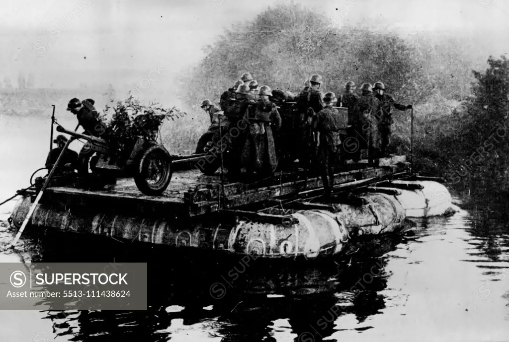 The Soviet Army -- Soviet soldiers, on manoeuvers crossing a waterway by means of a raft. According to Russian claims Germany has taken on more than she anticipated in her latest aggression, and the German drive has paused. September 23, 1941.