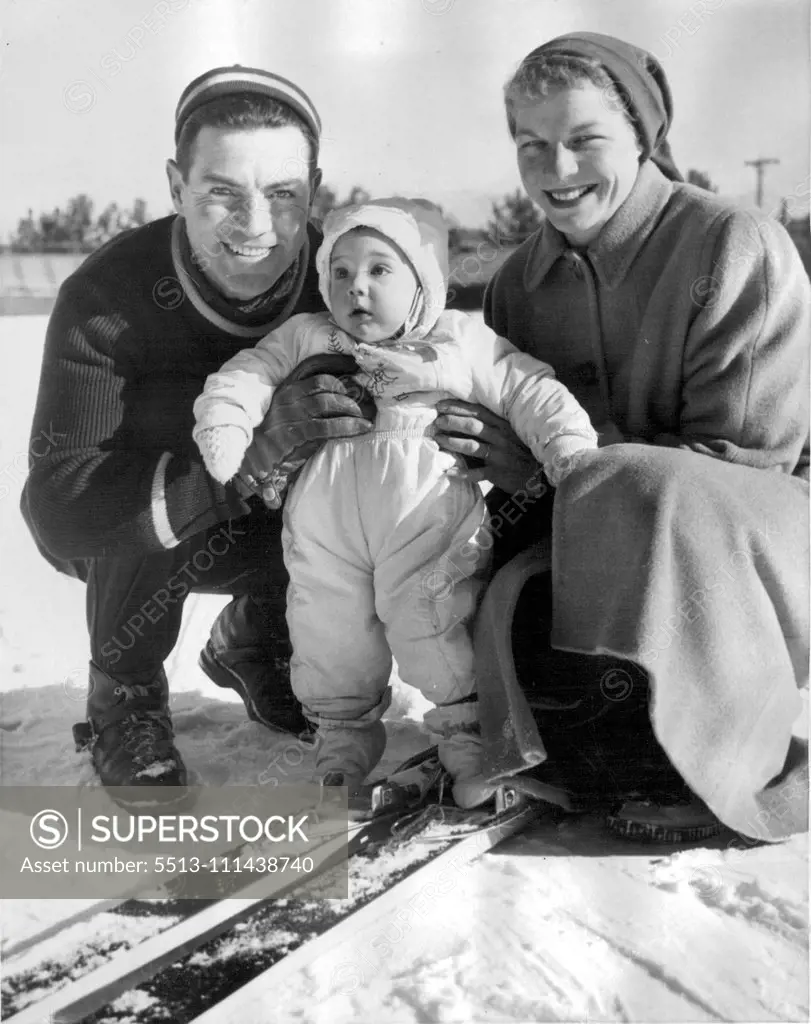 While Daddy's Away -- Art Devlin of the United States Olympic ski jumping team is headed for the Winter Olympics at Cortina, Italy, and while he's away, wife Helen will be taking care of their daughter Jackie, who looks as if she's ready for the snow sport. The members of the team were practicing at Lake Placid. December 31, 1955. (Photo by United Press Photo).