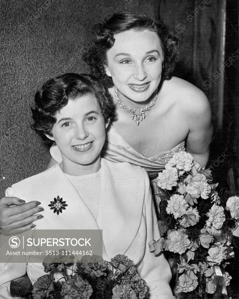 A charming picture of Judy Breen with Googie withers (One of the Judges). The final of the J. Arthur Rank Organizations "Festival Girl" contest took place at the Odeon, Tottenham Court Road, when miss Judy Been a 19 year old typist from Kensington, London, won the title. She will make an air trip round the world as part of her Prize. "Miss Festival" will be presented on stage at the State Theatre on Aug. 13 at a special midnight preview of Britain's best film of the year - "The Browning Versi