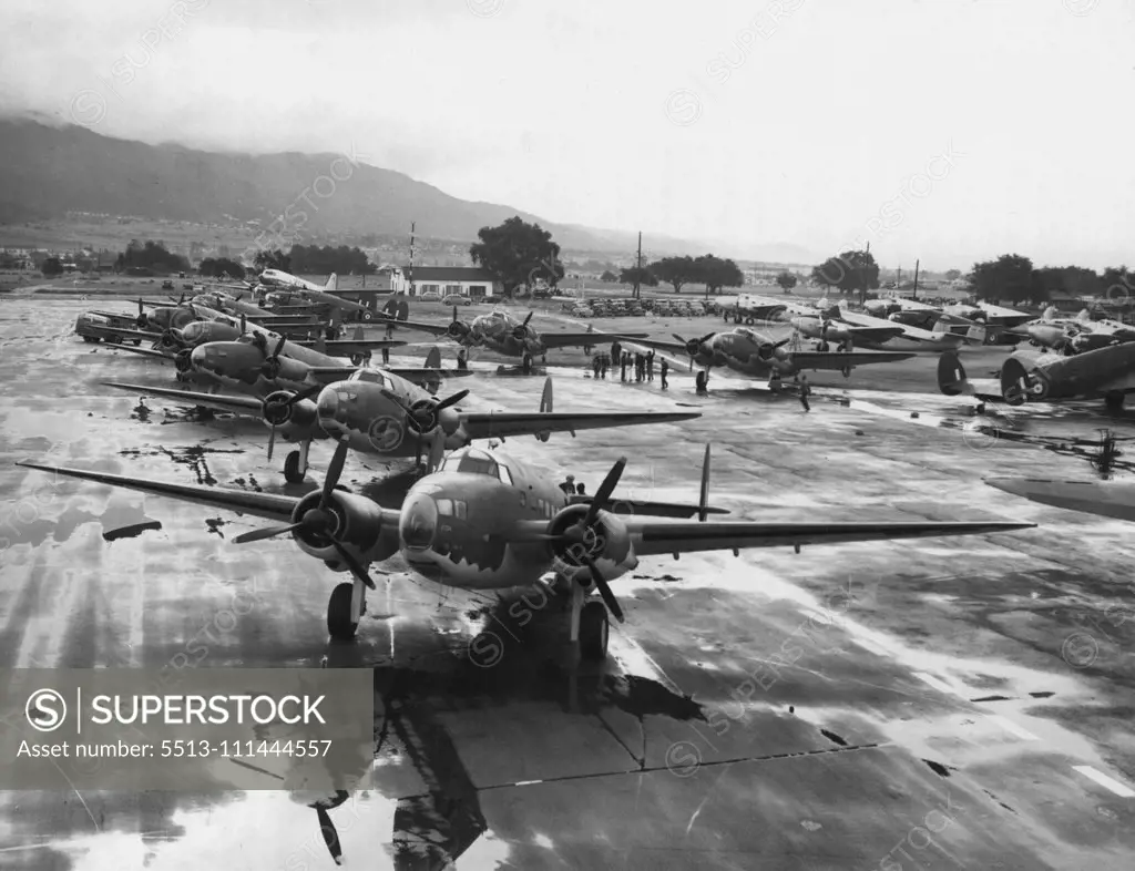 Bombers For Mass Delivery -- These 18 Lockheed Hudson Bombers, Camouflaged, are poised at a Los Angles, Calf., airport, April 2, for a flight Eastward, were described by company officials, as the greatest mass delivery in aviation history. They are valued at $2,000,000 and are destined for Great Britain, company spokes men said. April 4, 1941. (Photo by Associated Press Photo).