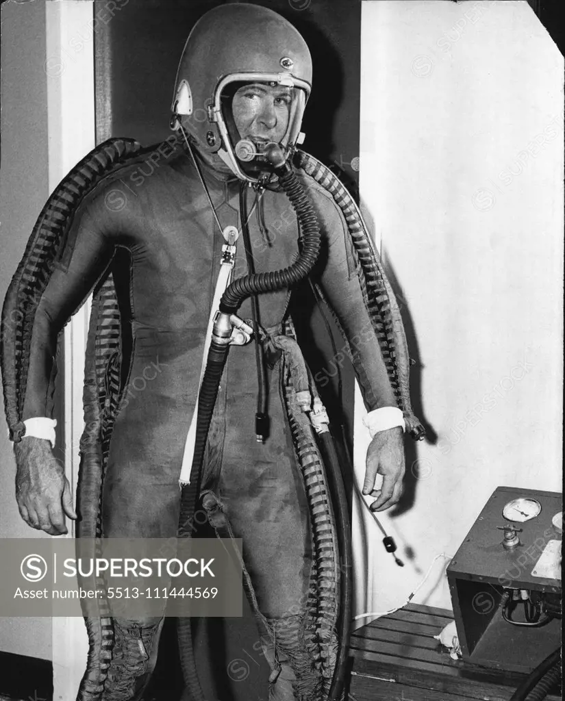 Test Pilot Bill Scott, in inflated pressure suit, only one in Australia, used for testing high altitude flying in our new jet machines. March 9, 1955. (Photo by Gordon F. De'lisle).