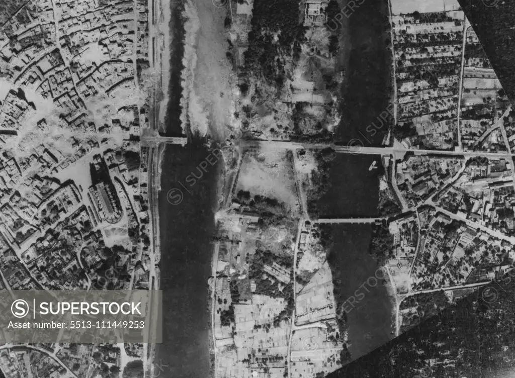 Allied Aircraft Wreck Seine Bridges. The wrecked highway bridge across the Seine at Mantes/Gassicourt North-West of Paris which was attacked by A.E.A.F.A. aircraft recently. By smashing road and railway bridges over the River Seine, the A.E.A.F.A. hindered the movements of German reinforcements for the invasion area. June 8, 1944. (Photo by British Official Photo).