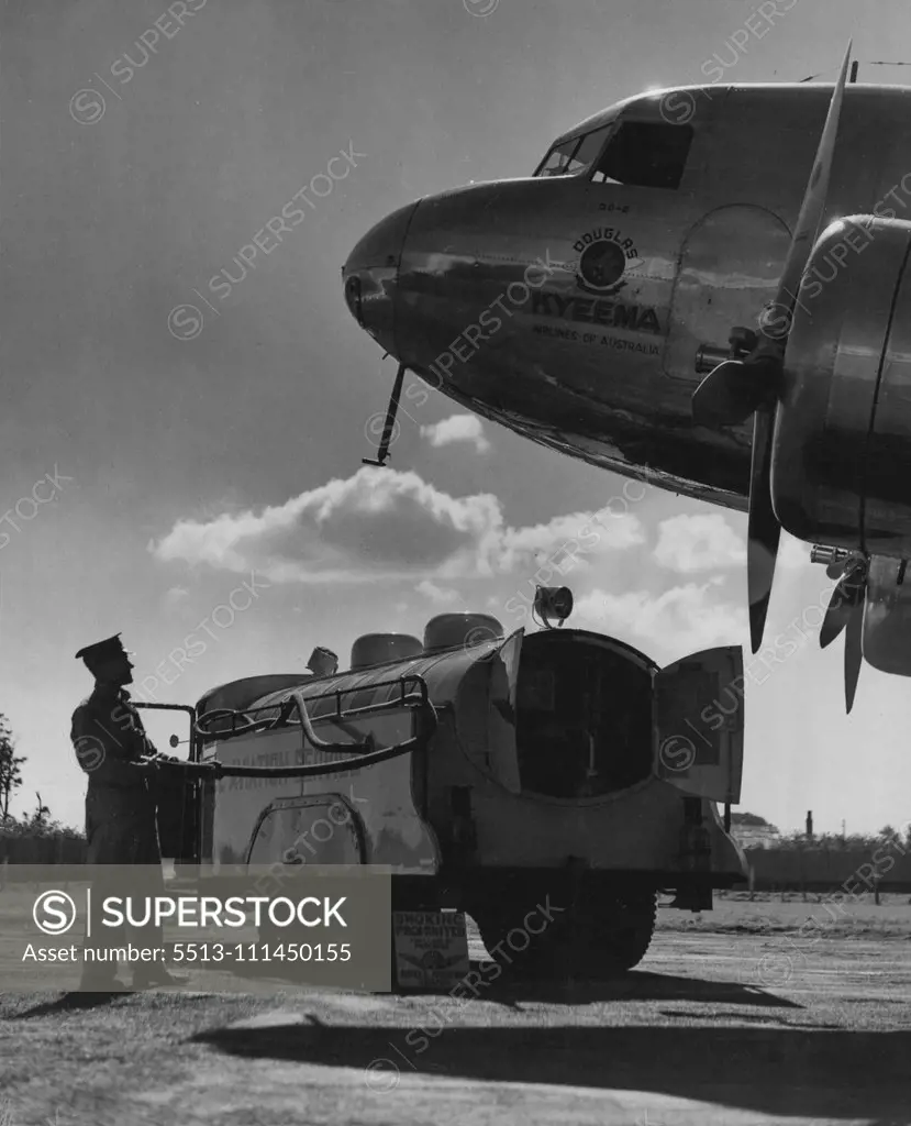 The giant Douglas DC2 airliner, "Kyeema," of Airlines of Australia, makes a striking early morning study as she refuels from the Shell refuelling Waggon at Mascot aerodrome. The machine is engaged on the Sydney-Brisbane service. August 15, 1937.