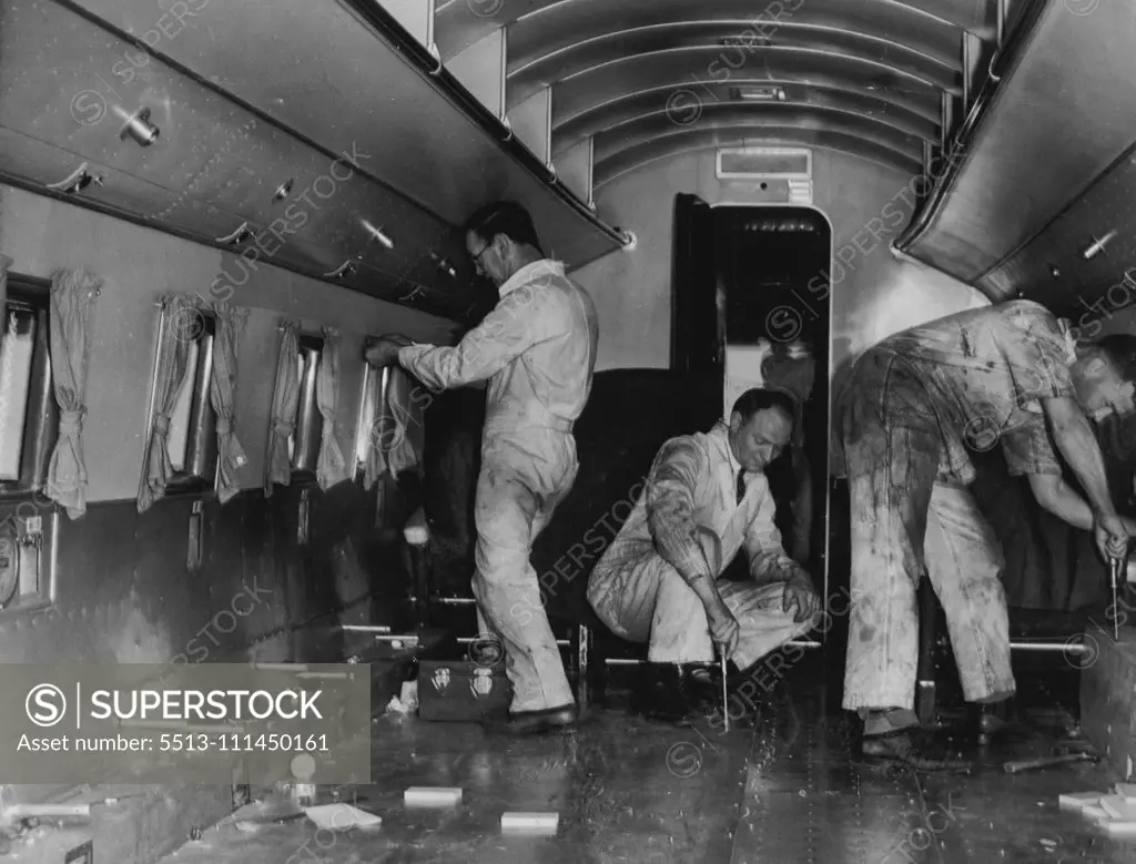 Four trips from Darwin to Calcutta and back before Christmas is the schedule of the big Douglas DC3 airliner, Kurana, which has been chartered from Australian national airways by imperial airways to help cope with the huge bulk of Christmas mails from overseas. Today's picture at Essendon is of the interior of the airliner stripped of its seats and other fitting in preparation for the mail transport. This year will mark the first occasion on which all first class Christmas mails from Great Brita