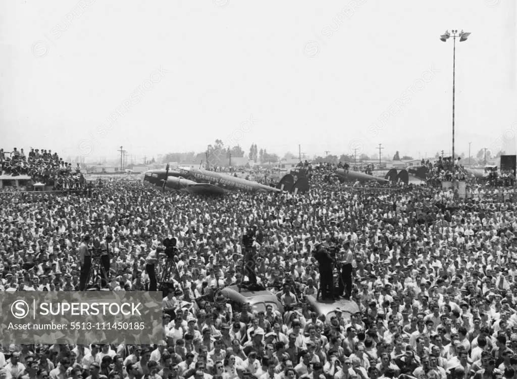 Lockheed Workers Hear Halifax -- Lockheed Aircraft ***** workers listen to Viscount Halifax, British ambassador to the United States, as he talked to them July 18 at Burbank, Calif.,on the completion of the 1000th Lockheed Hudson Bomber. This plane is used by the R.A.F. Coastal command. July 18, 1941. (Photo by Associated Press Photo).