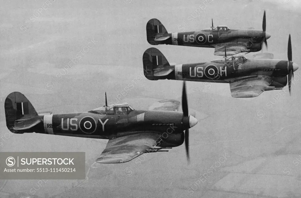 First Pictures of the Typhoon one of most Formidable Aircraft used by Fighter Command -- An aerial view of Typhoons flying in formation. These are the first pictures to be released of the Hawker "Typhoon" described as one of the most formidable aircraft in use in Fighter Command. Powered with the famous Napior engine the Typhoon is a single seater low-wing monoplane of metal construction. Its armament consists of cither four cannons or twelve machine guns. Already Squadrons equipped these fighte