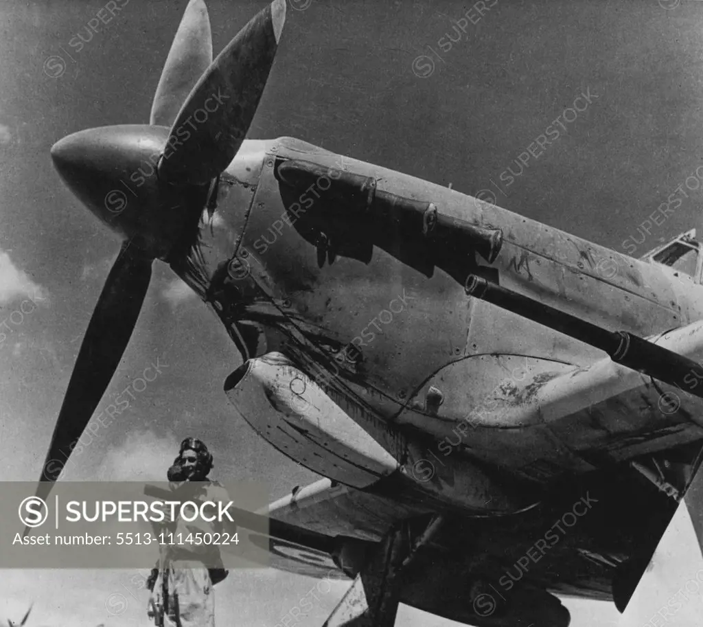 R.A.F. "Tin Openers" In Middle East -- This is one of the first photographs released of the R.A.F' s. new Tank Buster a Hawker Hurricane 11D fighter - fitted with heavy calibre guns, designed primarily for attacking armoured vehicles. The Hurricane 11D carries tow 40-millimetre guns, one being fitted under each wing. They are capable of either automatic or single shot fire, have been specially designed for mounting on aircraft, and the weight of each is only 320 lb. June 3, 1943. (Photo by Depar