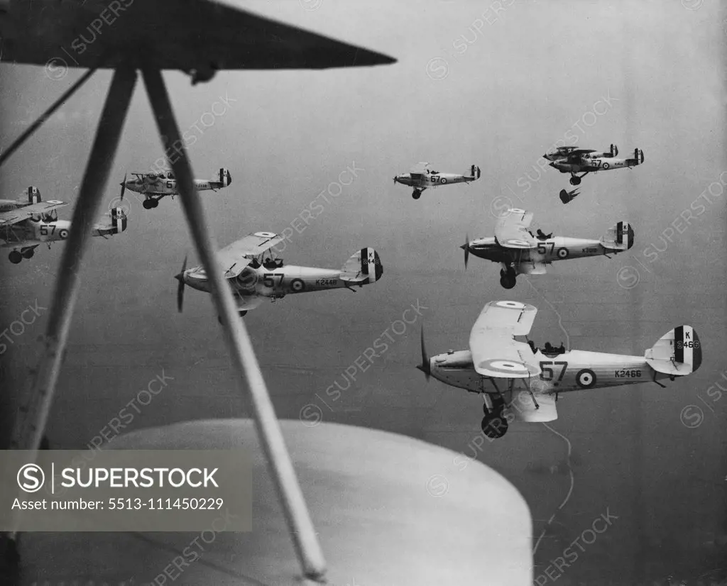 R.A.F. Practice ***** -- The 57th squadron rehearsing their diplay at Eyford  today. Planes of the 57th R.A.F. squadron rehearsed their display for the forthcoming R.A.F pageant which takes place at Hendon, at upper Heyford, Oxon, today May 29. May 29, 1934. (Photo by The Associated Press of Great Britain Ltd.).