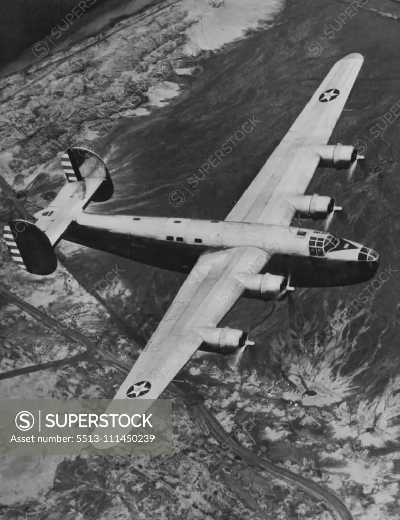 New Bomber Undergone Tests -- Consolidated aircraft Corporation's powerful new four-motored land bomber (above), designate as XB-24 by the army, is shown during a trial spin recently. The army, is shown during a trial spin recently. The ship which weighs 40,000 pounds and has a wing span of 110 feet, is driven by four 1200-H.P. Pratt & Whitney motors, capable of a speed of 300 M.P.H. for Approximately 3,000 miles. The bomb load is four tons. October 5, 1940. (Photo by ACME Photo).