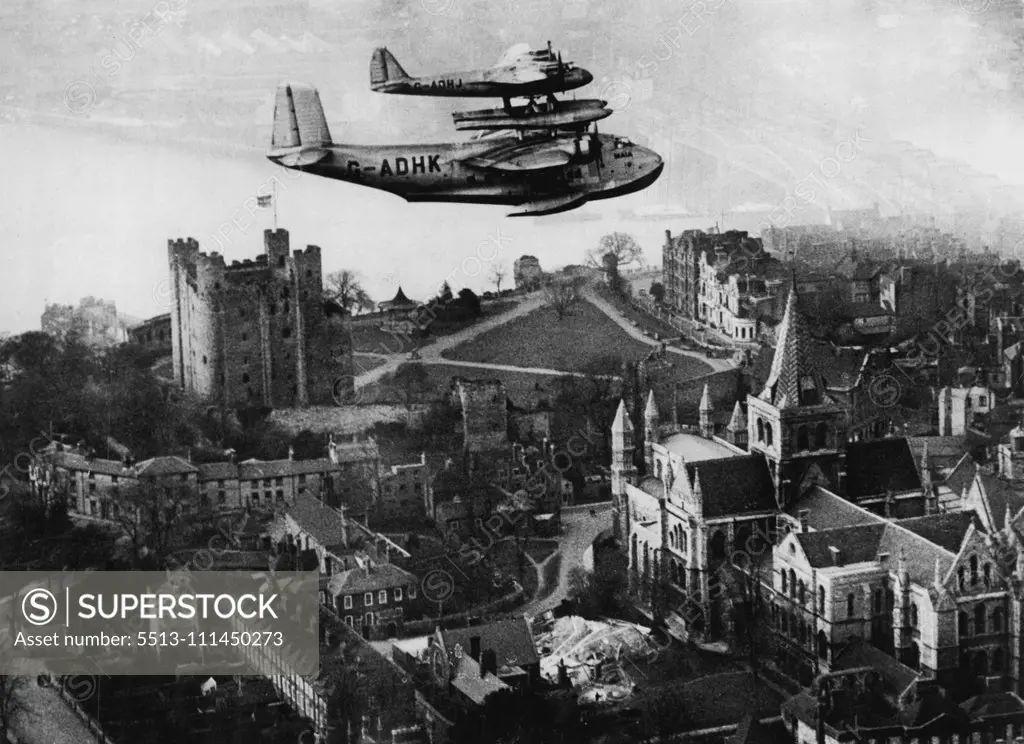 Mayo Composite Makes A "Separation" Test Flight -- The Mayo composite flying over Rochester Castle during the test flight today. The Mayo composite machine this afternoon made a test flight at Rochester, during which the machines parted in Mid-Air. February 23, 1938. (Photo by Keystone).