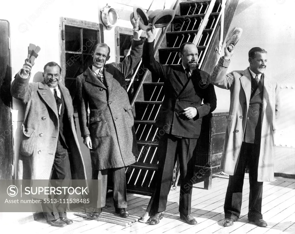 Hearst-Wilkins Expedition Returning From The Antarctic: Sir Hubert Wilkins, noted explorer, with members of his party returning from Montevideo on the S.S. Eastern Prince bringing to a close the second Hearst-Wilkins Antarctic Expedition. On Feb. 1, Sir Hubert flew 600 miles from his base on deception island, making observations and taking pictures. L to R - Parker Cramer, Pilot; Orval Porter, Mechanic; Sir Hubert Wilkins and Al Cheesman, Pilot. March 19, 1930. (Photo by International News Photo