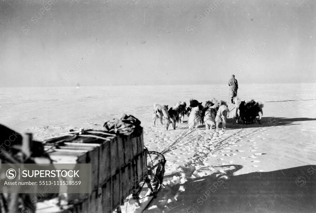 British Arctic Expedition: Driving with fill teams at beginning of journey with fully loaded sledge. November 26, 1934. (Photo by Martin Lindsay).