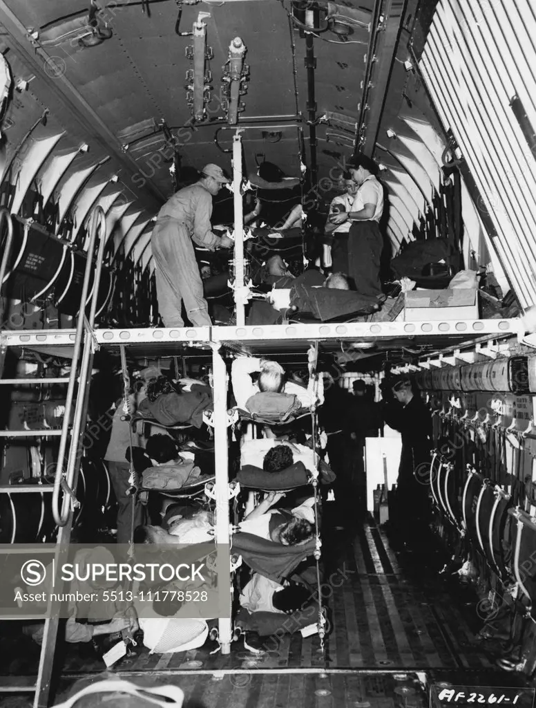 Double Deck Hospital Airplane Instead of having to wait at an airstrip in Korea for evacuation on smaller aircraft, nearly 100 Patients are loaded into a giant C-124 of the 374th Troop Carrier Wing/(Combat Cargo) and brought to Japan for further treatment at hospitals here. Because of its larger capacity, this U. S. Air Force Globemaster can bring back more men quicker, and get them started on the road to recovery faster. The spacious double-deck interior of the plane can carry as many patients