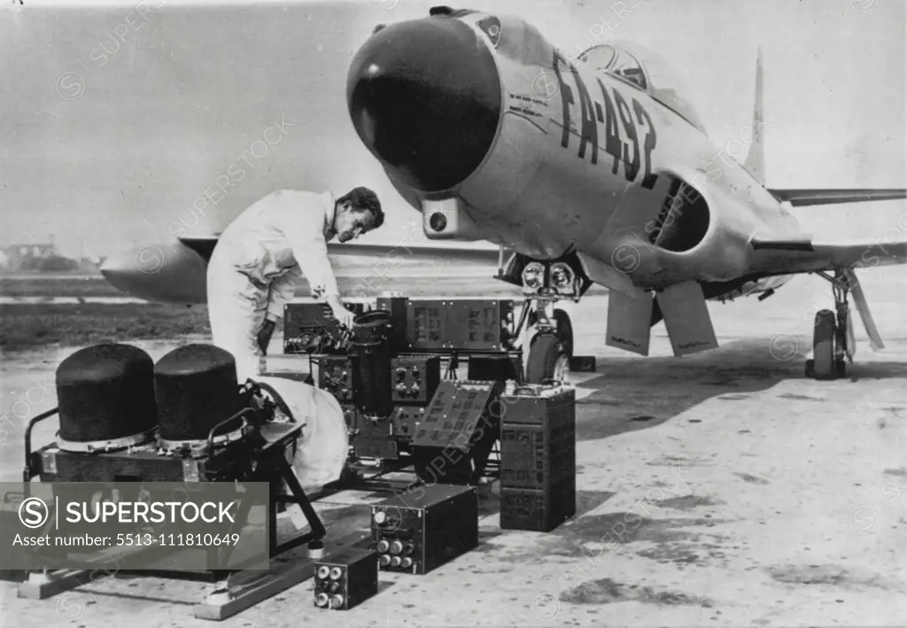 'Brain Lobes' of Electronics Seek And Destroy System -- On ground in front of this F-94 interceptor plane are the different parts of the electronic brain used in the "seek-find-and-kill" system which enables an interceptor to locate enemy aircraft at long range, regardless of visibility, direct the pilot to the target and launch the armament at the correct instant. Secret of how it is done was revealed today at the Hughes Aircraft Co., Culver City, Calif. October 05, 1955. (Photo by AP Wirephoto