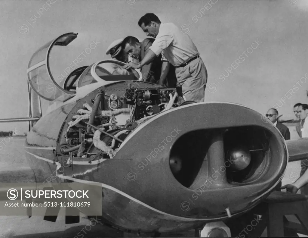 Spain's First Jet Plane: The Spanish air minister, Lt. General Gonzalez Gallarza inspecting the plane before it took off. The first jet plane to be made in Spain-the "Saeta Ha.A - 200Rl - was given its first test flight over San Pablo this week. August 18, 1955. (Photo by Paul Popper Ltd.).