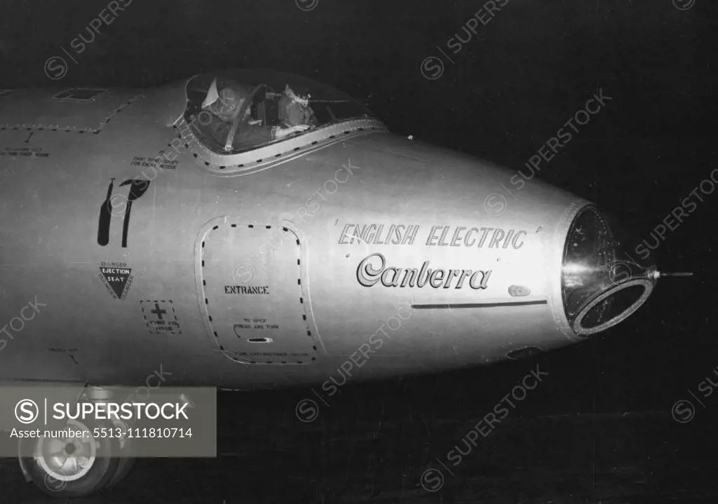 London-New York and Back In 14½ Hours -- The records-making Canberra taxis across a London Airport runway last night on its return from New York. Navigator Moneypenny is nearest camera. A silver-painted English Electric Canberra Jet Bomber roared over London last night after a 14½-hour flight to New York and back, during which it established three speed records. The plane-piloted by Moustached John Hacktt and navigated Peter Moneypenny took off at 7.10 A.M. and arrived home again at 9.41 P.M. 