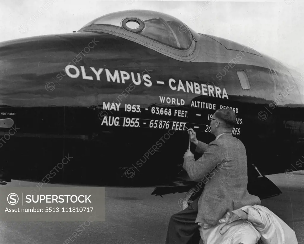 1955 Farnborough Air Show -- A sign-writer at work recording on the fuselage of the aircraft the fact that this Canberra aircraft has just established a new world height record. September 05, 1955. (Photo by Daily Express Picture).