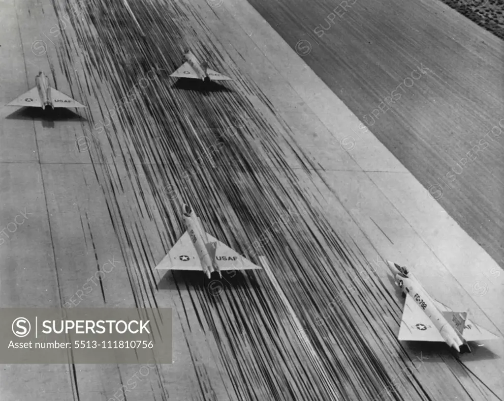 Illusion of Speed - These four Convair F-102A all-weather jet interceptors seem to be racing down runway at Palmdale, Calif. The planes are standing still but the illusion of speed comes from the delta wing interceptors streamlining and from the hundreds of tire streaks left on the concrete runway by landing aircraft. October 04, 1955. (Photo by AP Wirephoto).