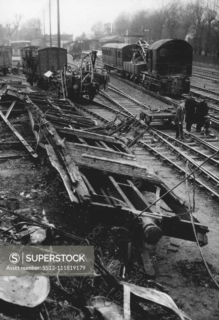 Remains Of Wrecked Coach After Rail Crash - The floor of a coach, barely recognisable, in which most of the 12 people who died lost their lives in a train accident just outside Barnes station London, at 11.28 last night. The wreckage, quickly being cleared to reopen the lines today (Saturday) is all that was left of the coach, which caught fire when an electric train from Waterloo to Windsor struck the rear of a goods train travelling from Battersea Yard to Brent. One hundred and fifty passenger