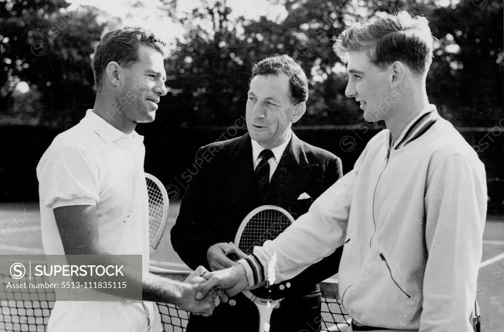 Australian As New Professional To The All-England Lawn Tennis Club : Dan Maskell (centre) introduces George Worthington (left) to Reg Bennett, one of England's most promising young players before a practice game. George Worthington, the Australian tennis player, has now taken up his appointment as Professional Coach to the All England Tennis Club at Wimbledon. Worthington Succeeds Dan Maskell, who now becomes training manager to the Lawn Tennis Association. October 06, 1955. (Photo by Sport & G