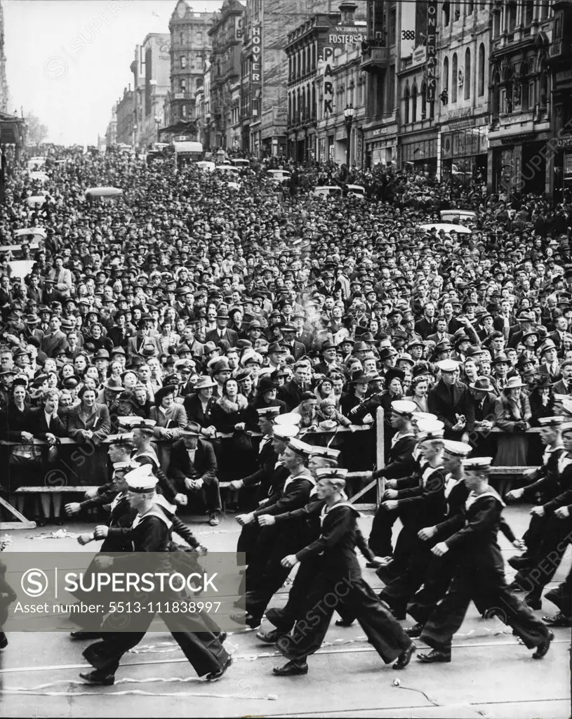 Sailors marching from Bourke St into Elizabeth St. portion of large crowd on Bourke St hall. This crowd lock ended right up to Queen St. October 21, 1941.