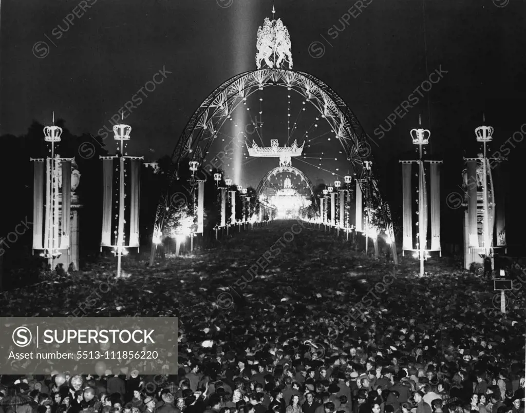 London Rejoices On Coronation Night -- Colossal crowds thronging the magnificently floodlit Mall tonight, which is still a surging mass of happy people from end to end. To terminate the magnificent day of pageantry and splendour, London is rejoicing after the Coronation of The Queen. Streets and buildings are floodlit, balls are taking place, wonderful firework displays are being enjoyed and everyone is celebrating in their own particular way. June 02, 1953. (Photo by Fox Photos).;London Rejoice