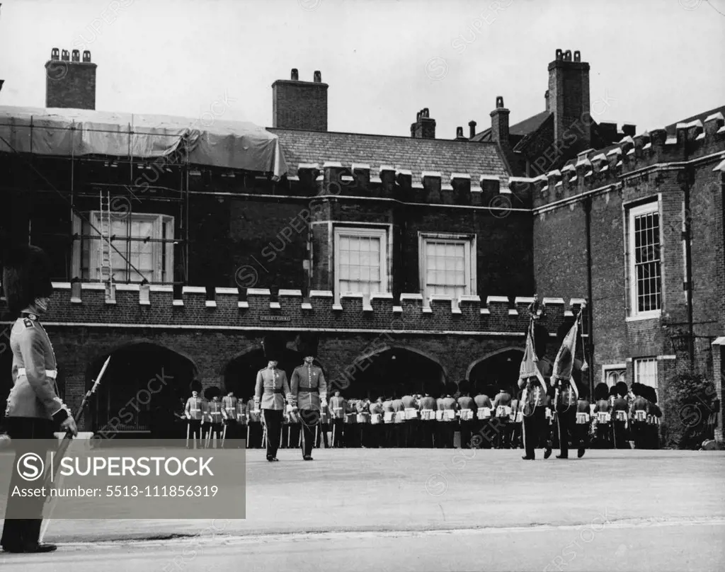 Changing of the Guard Now at St. James's Palace So As Not To Disturb The King - The Grenadier guards are being relieved by the Scots guards during today's changing of the guard at St. James's Palace. Today's changing of the guard ceremony took place at St. James's Palace instead of at buckingham palace, so as to avoid disturbing the king during his recuperation from his recent operation at Buckingham palace. September 23, 1951. (Photo by Paul Popper Ltd. ). ;Changing of the Guard No