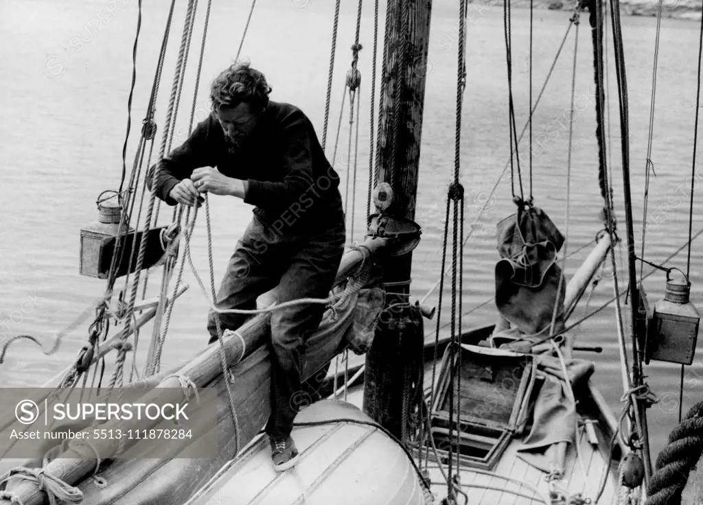 Crossed The Atlantic Twice -- On his 29-foot Yawl Temptress is 35-year-old Edward Allcard, naval architect of Cobham, Surrey, here he is just after arriving at Plymouth, Devonshire, after completing the double crossing of the Atlantic in the Yawl. The only food he had left was five potatoes. Some hard biscuits, and some tins of corned beef. The voyage from Casablanca should have been completed in under 30 days, but strong headwinds kept the Yawl back, and the voyage took 42 days.Allcard had no s