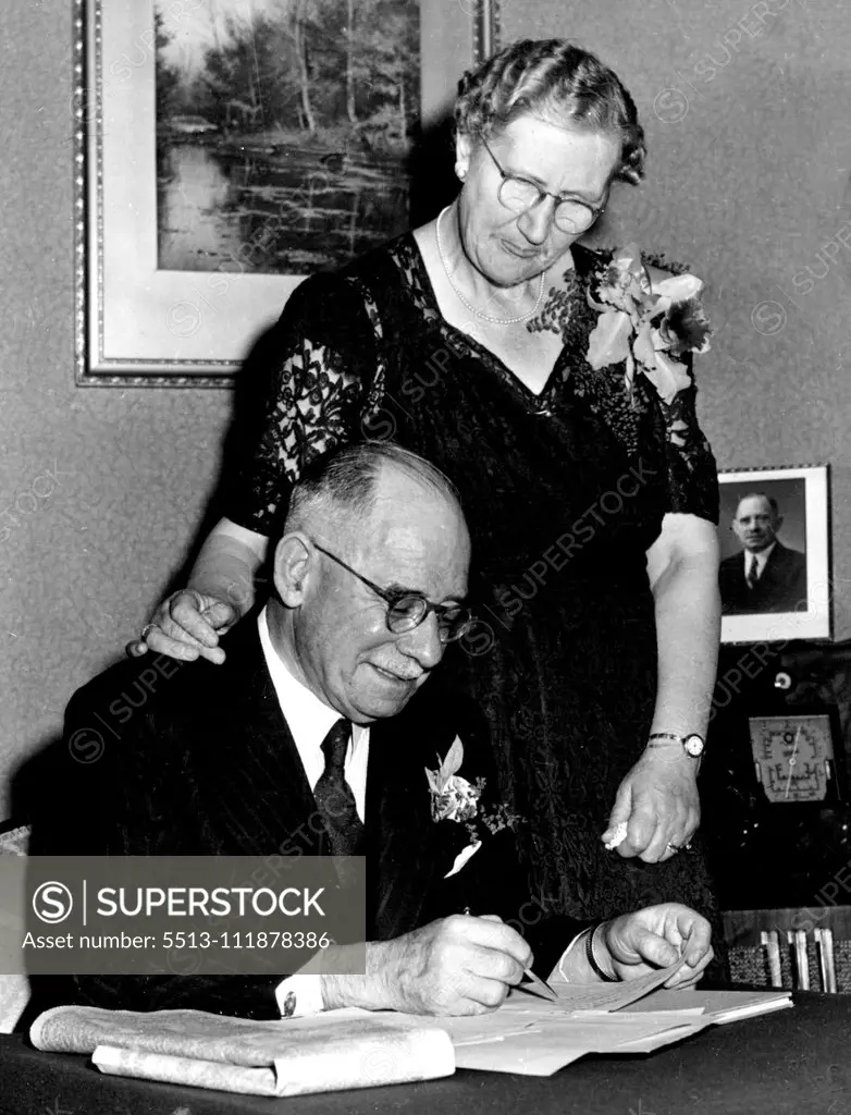 Allum and his wife at home, keeping a radio tally of votes during the Cast Municipal Election. June 27, 1952.