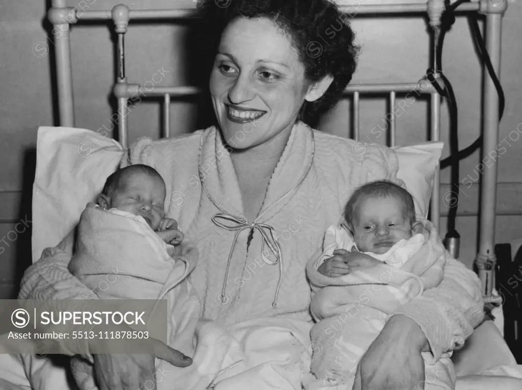 Forty Nappies A Day - Dark-eyed Mrs. Gita Wiernik (above) received the surprise of her life in triplicate.Until her triplet daughter were born, she expected twins."I did not want to frighten her, so I told her to expect twins when to expect twins when the doctor broke the news to me a few months ago," said Mr. Wiernik."I asked all the nurses and doctors at the hospital to keep the secret, and until they arrived, my wife was still expecting twins." October 27, 1955.