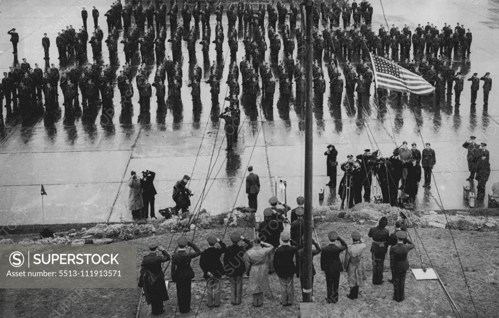 Eagle Squadron Transfer To U.S. Command -- The Eagle Squadrons saluting as the stars and stripes is run up at the ceremonial handing over.The three famous American Eagle Squadrons 71,121, and 133 of fighter command since the first year of the war and have, during that time, destroyed 73½ enemy aircraft, were transferred to the command of the U.S. Army air cords today Sept. 29. They will now become the fourth fighter group of the Bight U.S. fighter command under the command Col. Edward Wharton An