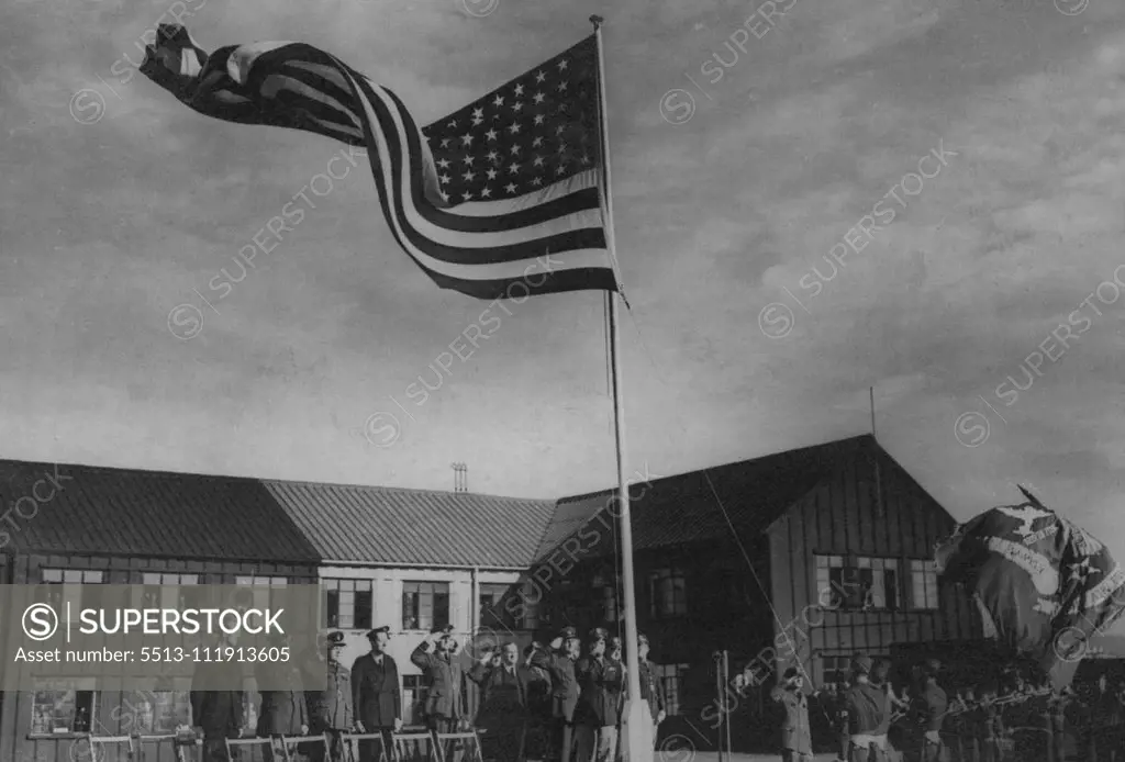 Transfer Ceremony of The 8th U.S. Air Force -- Raising the "Stars and Stripes" during the ceremony.One of the many repair depots in the United Kingdom was formally transferred to the United States VIII Air Force Service Command "Somewhere in the North of England". This station which has been under the control of the Ministry of Aircraft by Air Vice-Marshal Weedon, and was accepted by Major General Henry J.F. Miller, of Miami, Florida, commanding general of the VIII Air Force service command. Oct